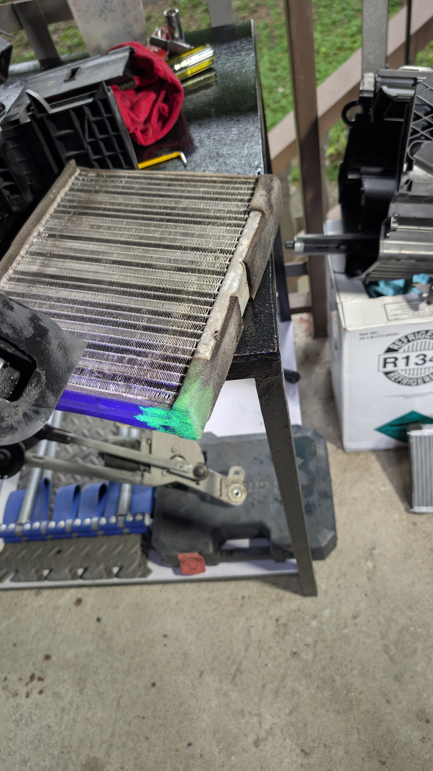 Vehicle air-conditioning component removed for service