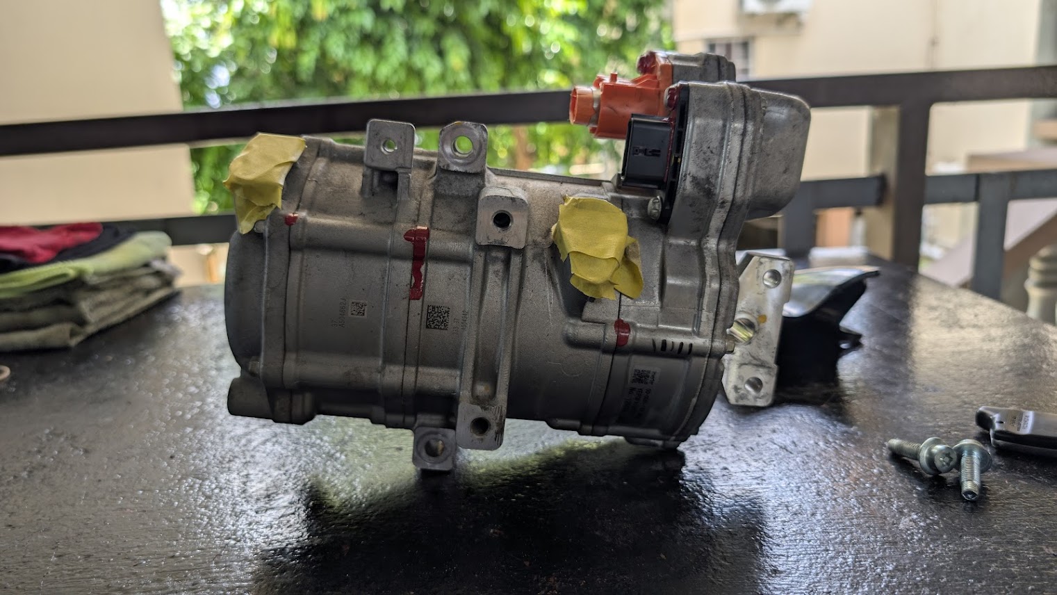 Automotive air-conditioning compressor being inspected